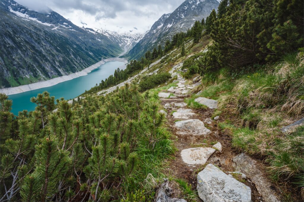 Beautiful view of Schlegeis Stausee on mountain hiking path trail. Zillertal, Austria, Europe